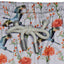 House of Malabaar boy's swim shorts with flying crane print.